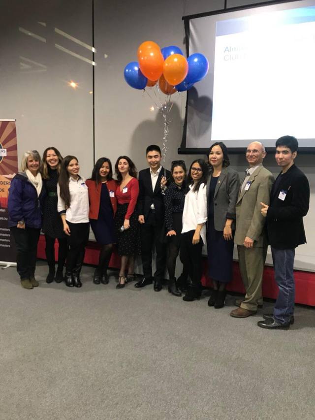 A Toastmasters club event in Almaty, the group posing with balloons